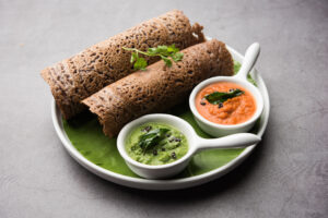 Ragi Dosa made using batter of Finger Millet is a healthy Indian breakfast served with chutney dosa